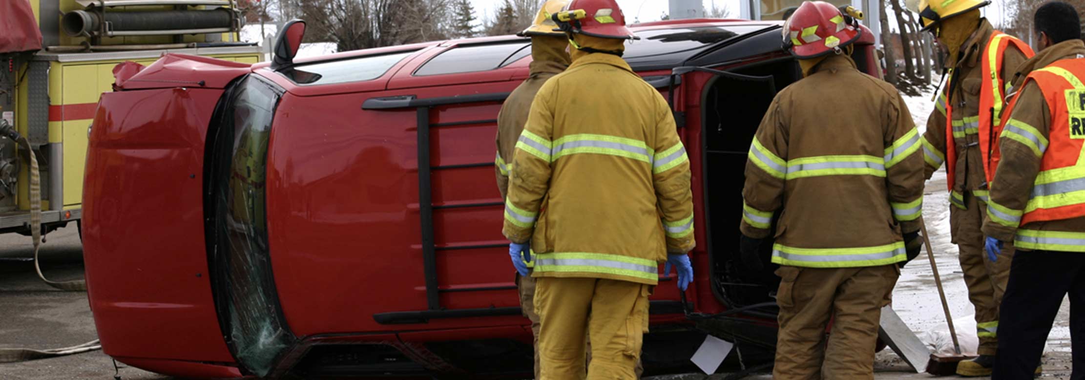 Paramedics help victims of a car accident.
