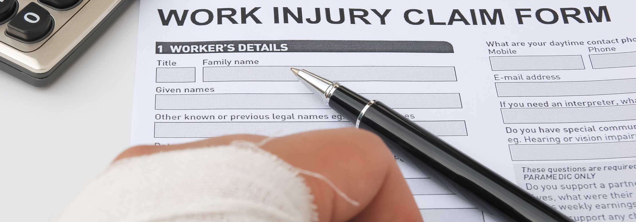 Injured worker hesitates to fill injury report form.