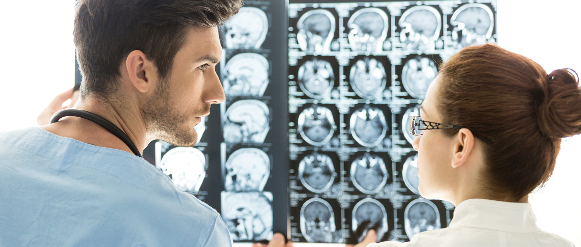Doctors examine brain scans.