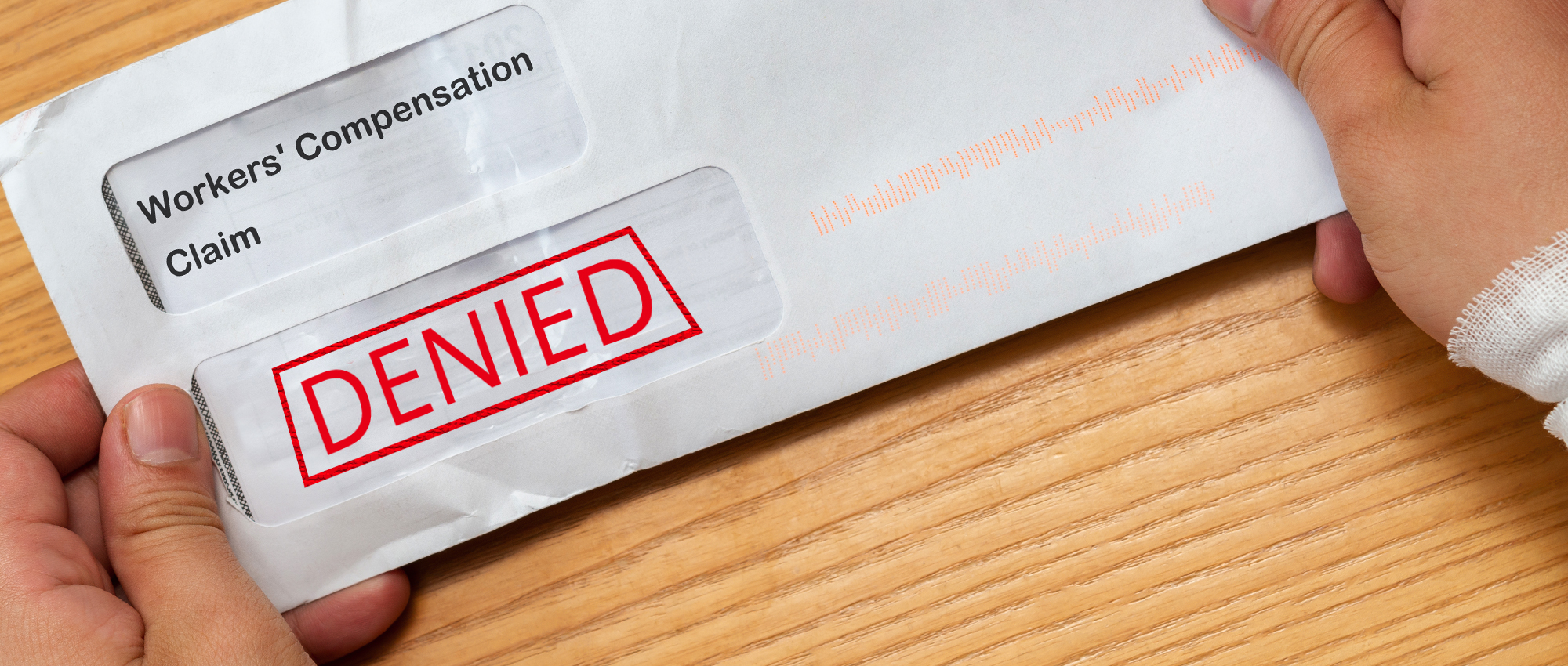 Envelope shows denied workers' compensation claim stamp.
