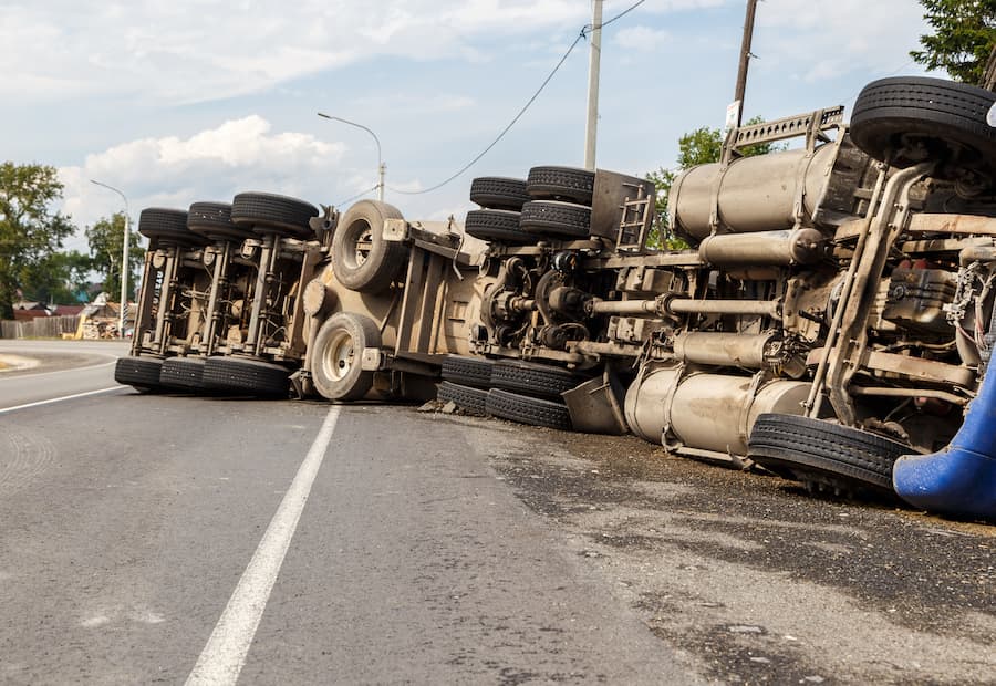 Truck overturned in highway as a result of an accident