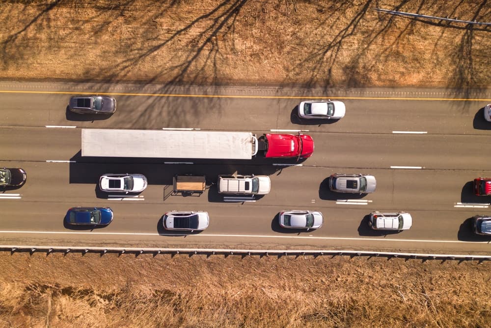 A semi truck traveling on the interstate