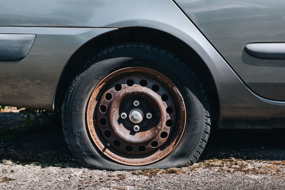 Defective tire in a passenger car wheel