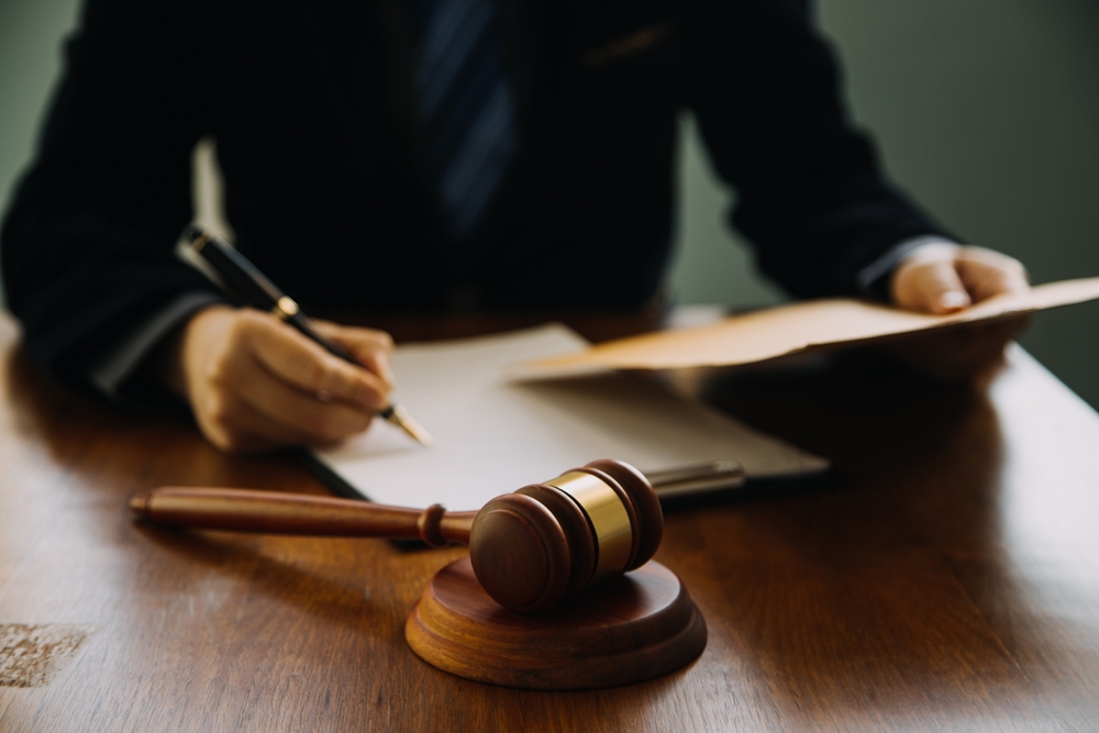 motorcycle accident lawyer working on a case in his office.