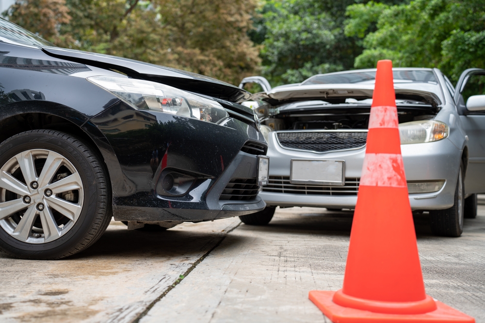 Two cars involved in a crash on the road.