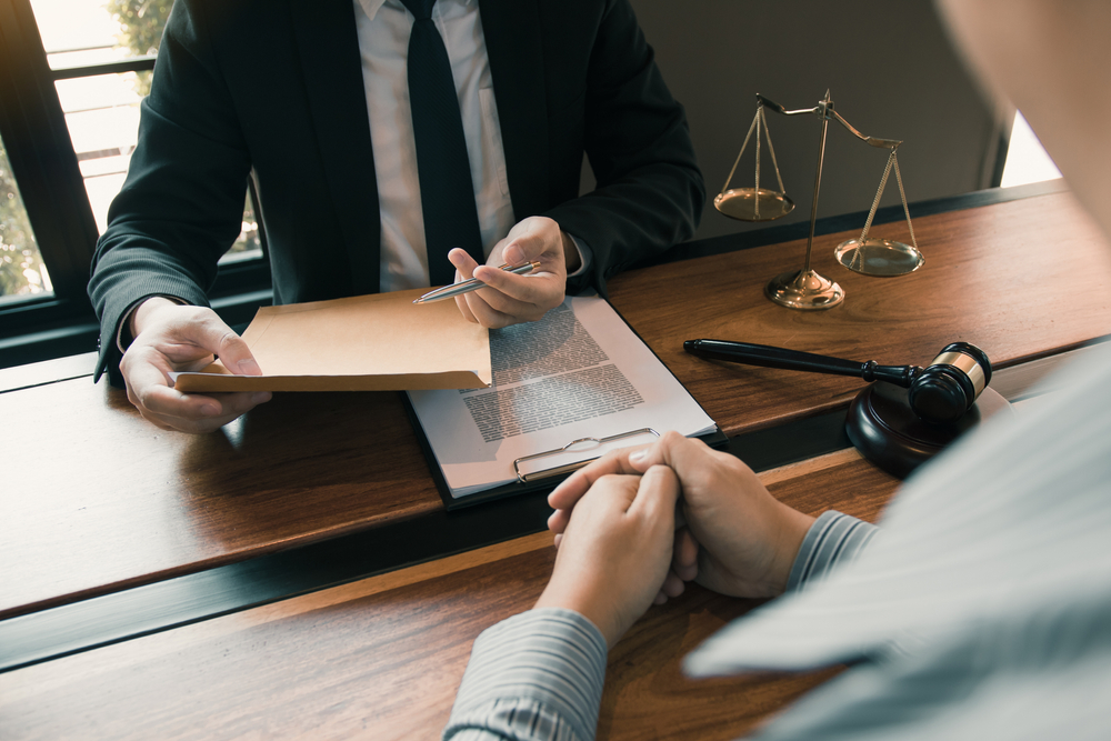 Clients come to seek advice for the law regarding privacy violations with the lawyer at the office.