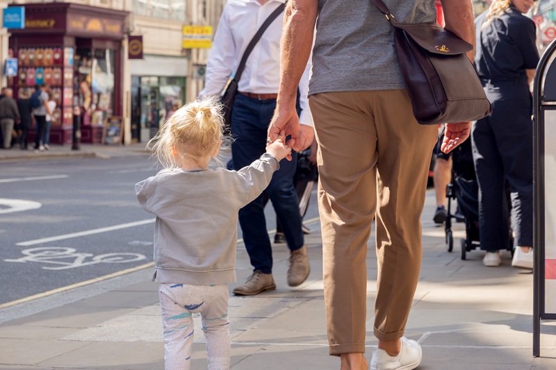 Pedestrians walking in a busy downtown area