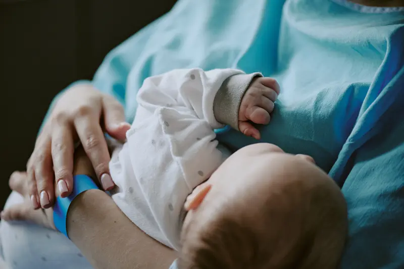 A baby being held closely.